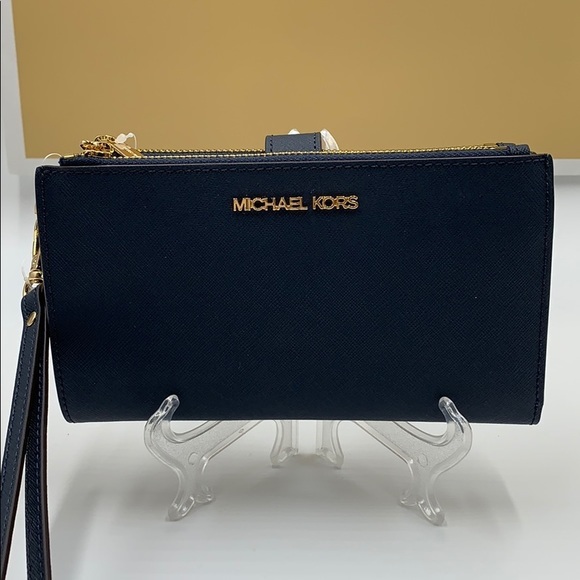 Michael Kors Handbags - MICHAEL KORS LG DOUBLE ZIP WRISTLET NAVY